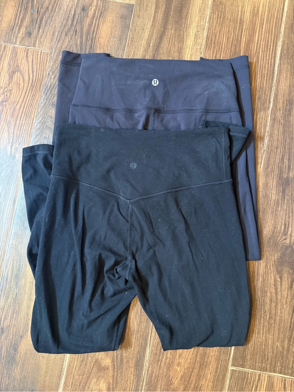 2 paif of leggings Lululemon and Athleta.